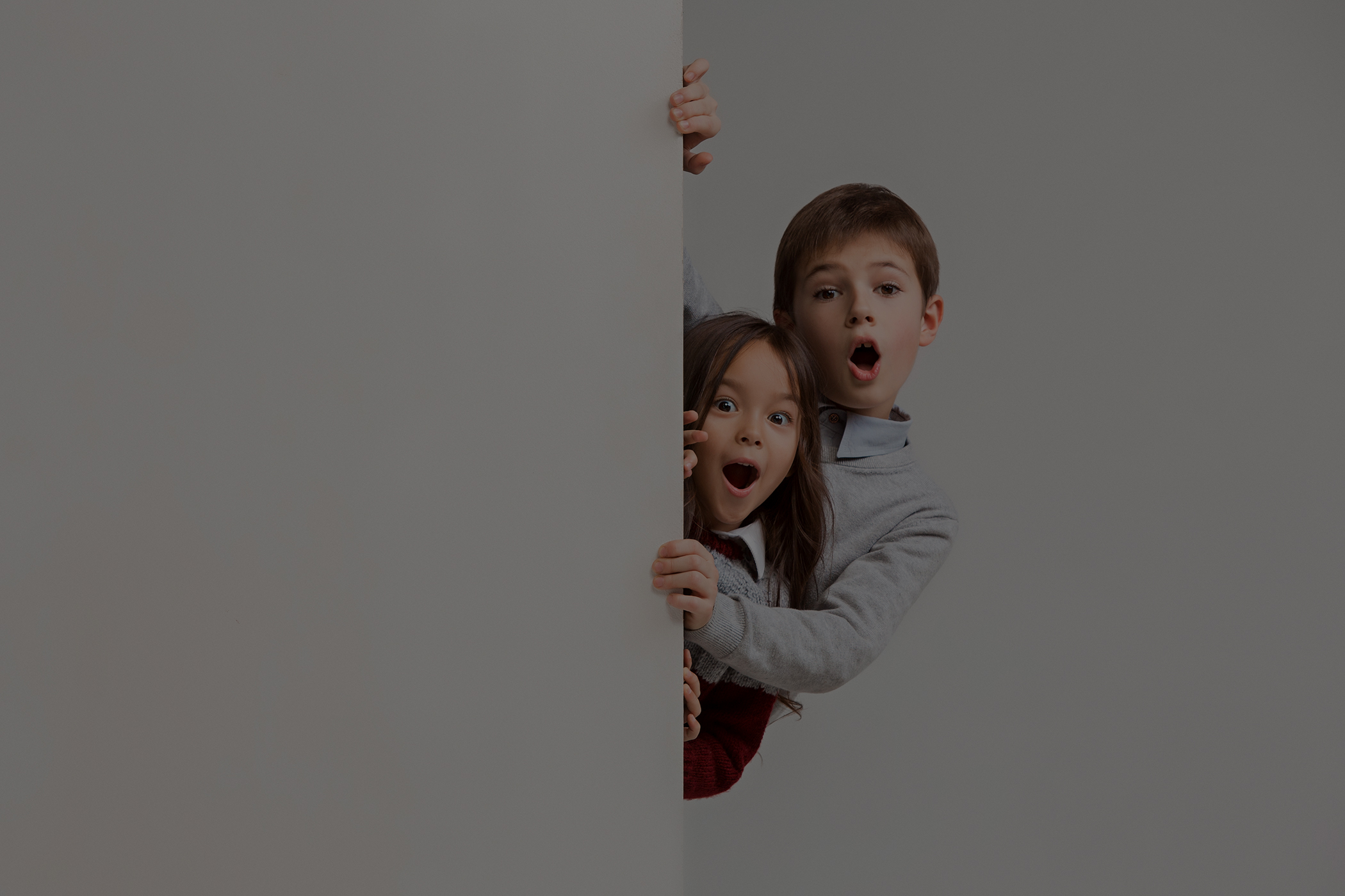 banner with a surprised children peeking at the edge low overlay