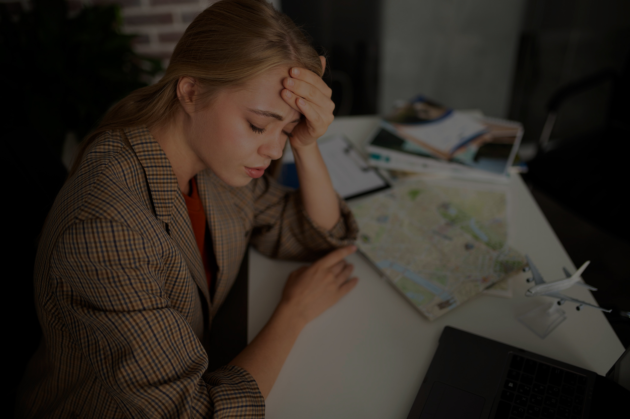 medium shot tired woman at travel agency low overlay